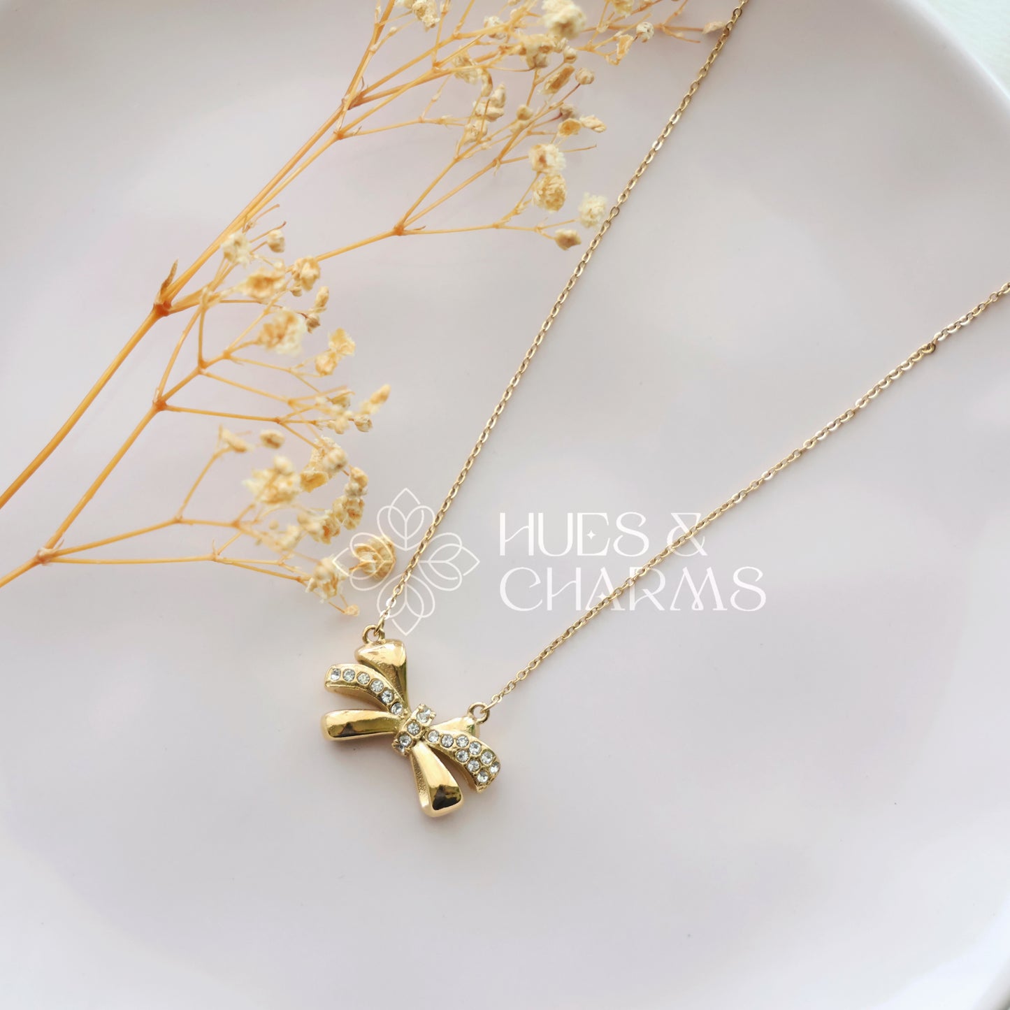 GOLDEN AD BOW PENDANT NECKPIECE