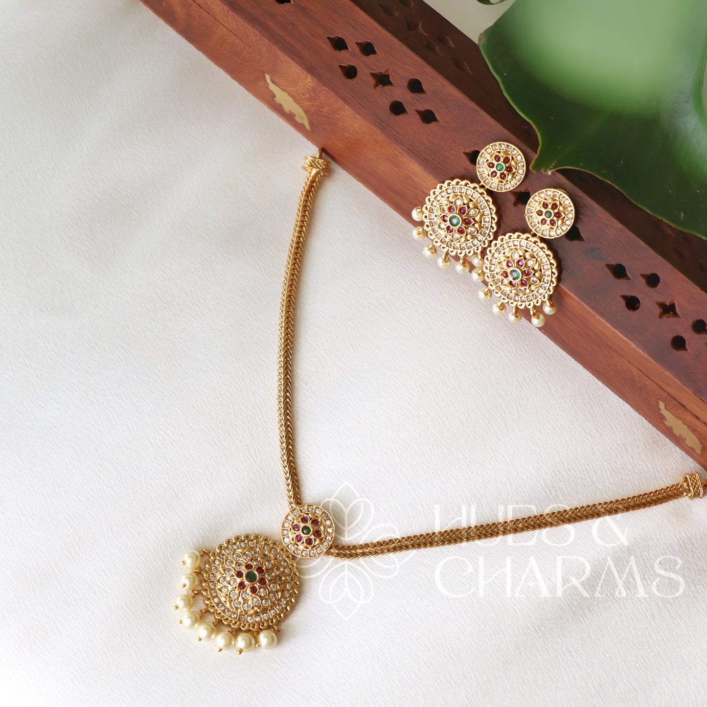 GOLDEN PUSHPA ATTIGAI NECKLACE SET