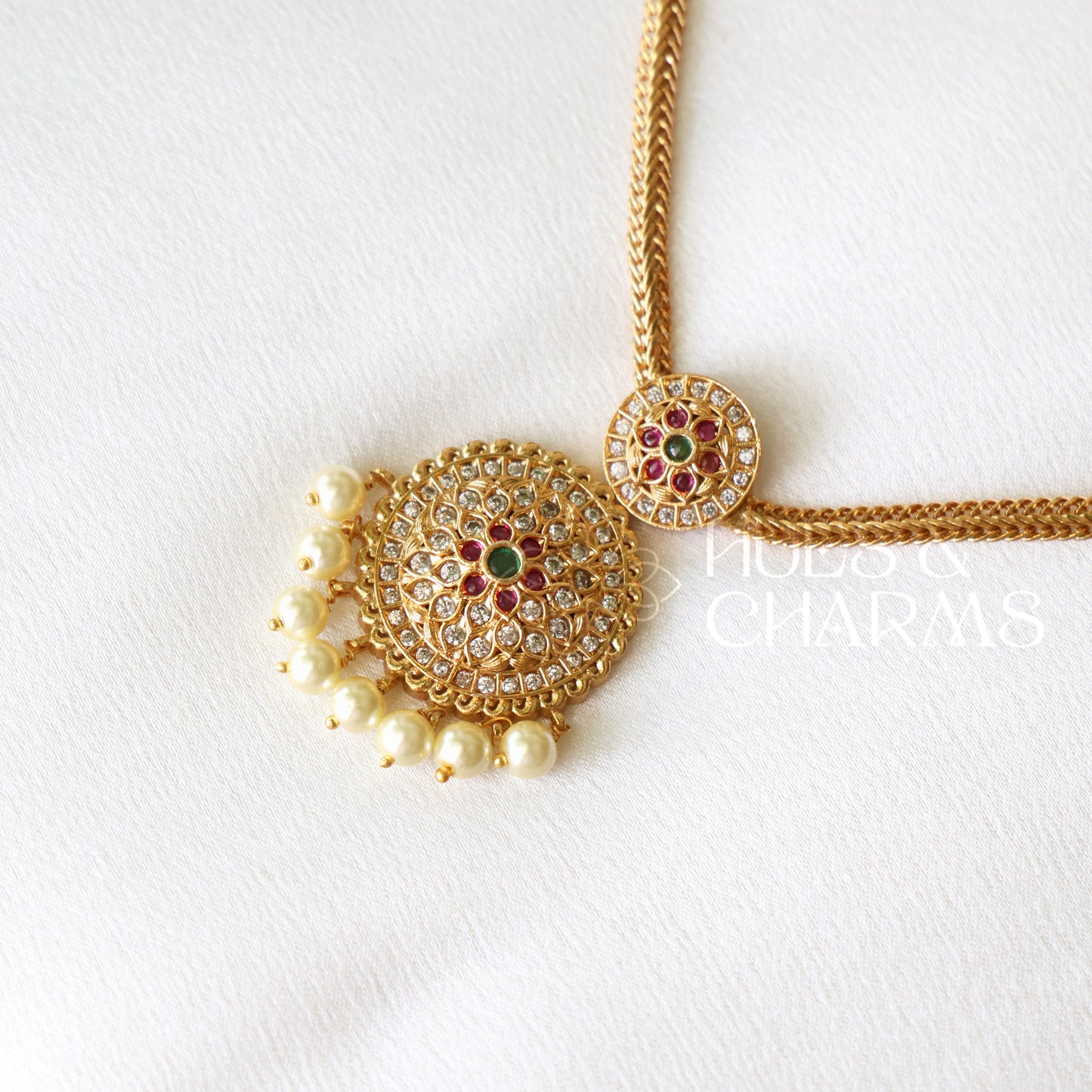 GOLDEN PUSHPA ATTIGAI NECKLACE SET