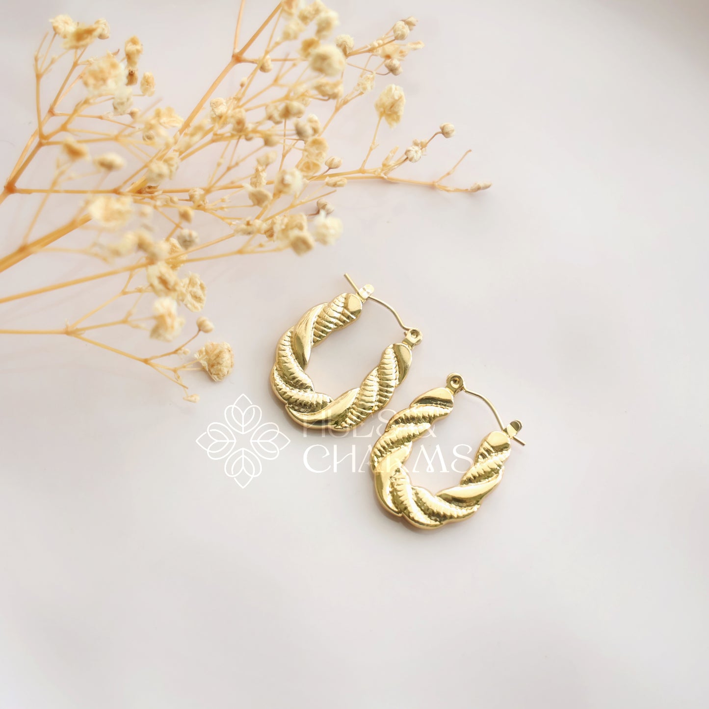 GOLDEN TWISTED OVAL HOOPS
