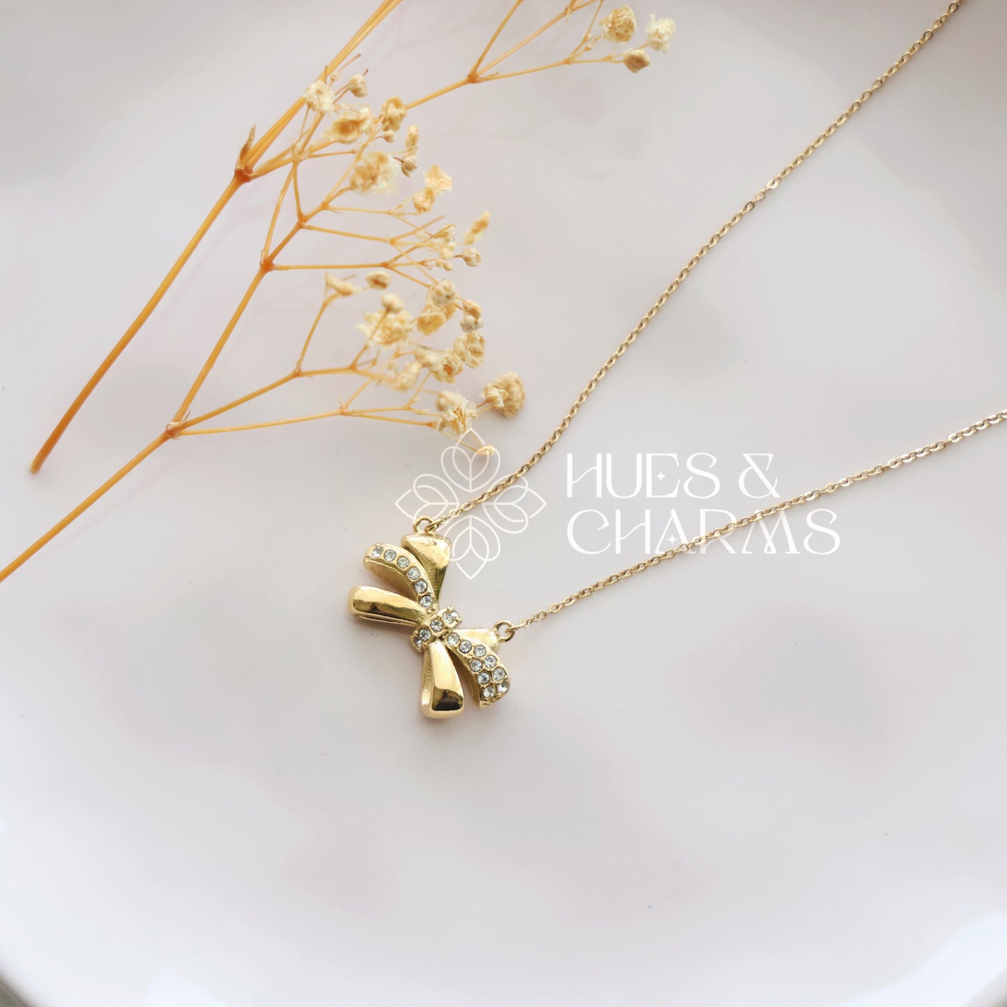 GOLDEN AD BOW PENDANT NECKPIECE