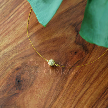 WHITE FLOATING BALL NECKPIECE
