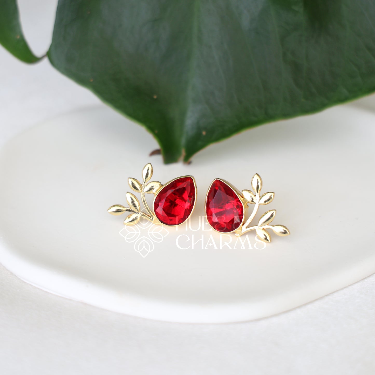 GOLDEN GLOSSY FLORA STUDS
