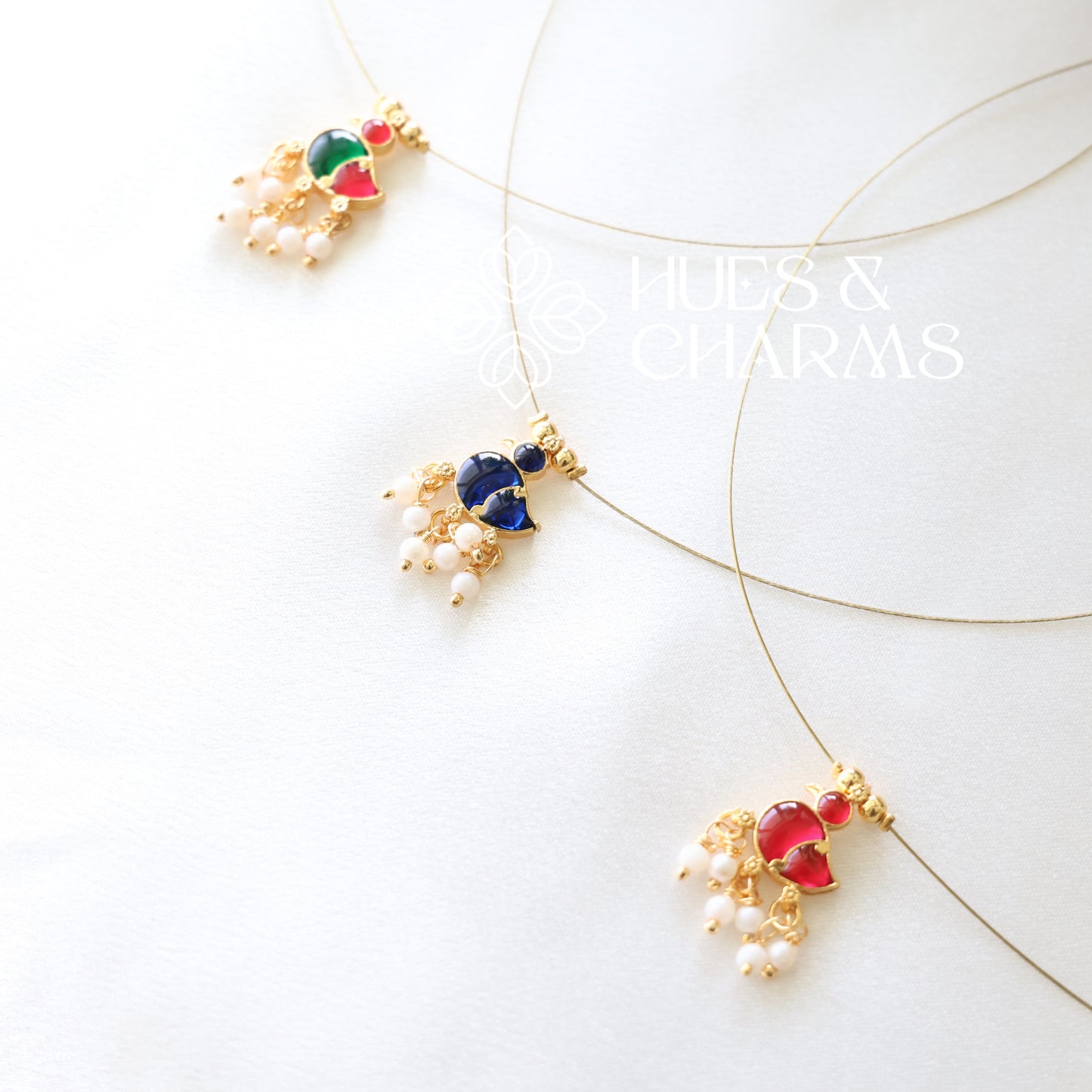 GOLDEN DUCK CHARM FLOATING NECKPIECE (COLOURS AVAILABLE)