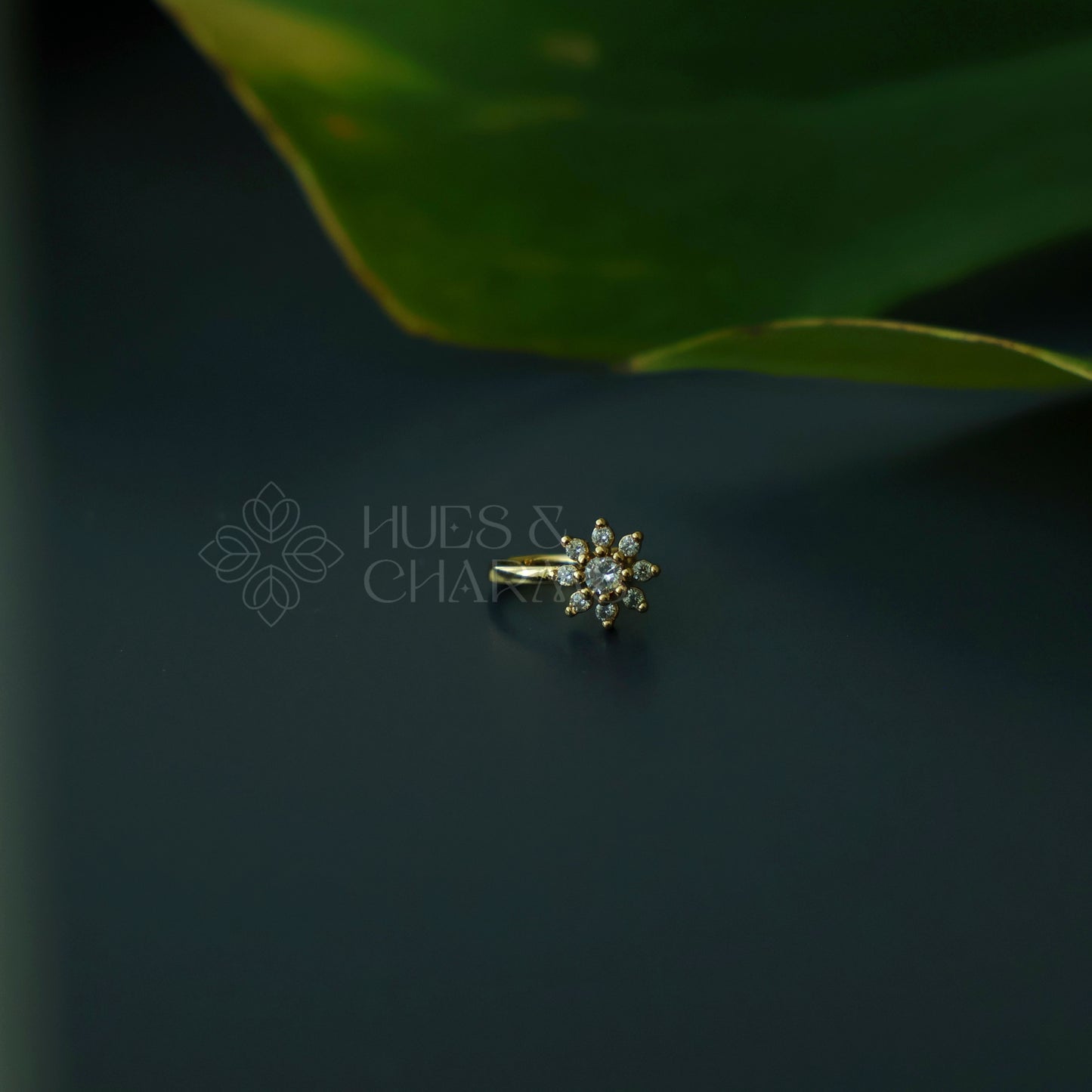 GOLDEN FLORAL AD STONES NOSE PIN