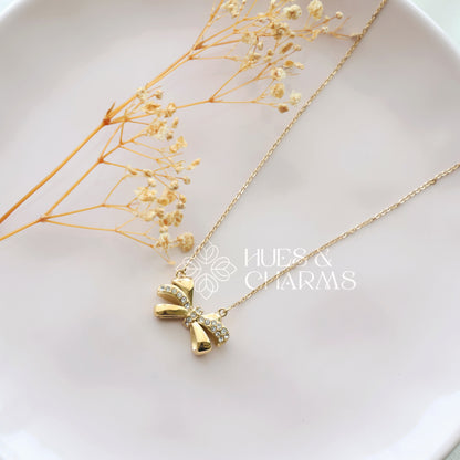 GOLDEN AD BOW PENDANT NECKPIECE