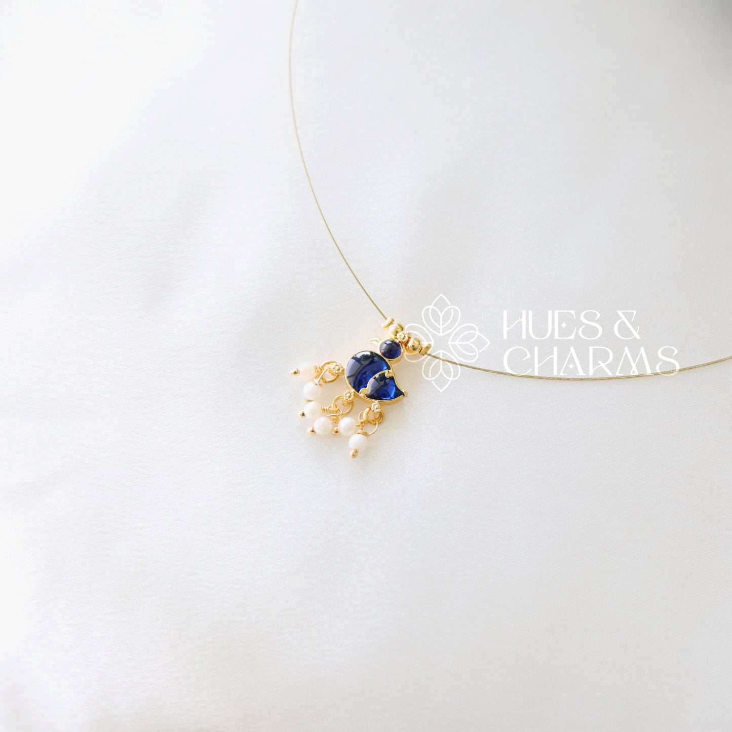 GOLDEN DUCK CHARM FLOATING NECKPIECE (COLOURS AVAILABLE)