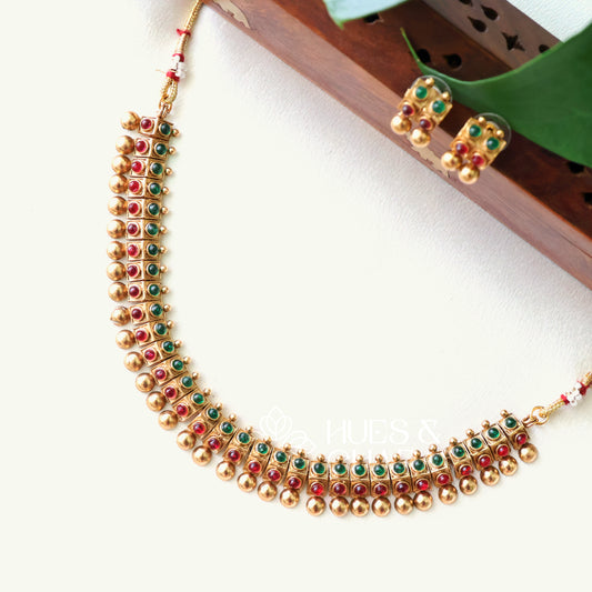GOLDEN VARNIKA RUBY AND GREEN NECKLACE SET